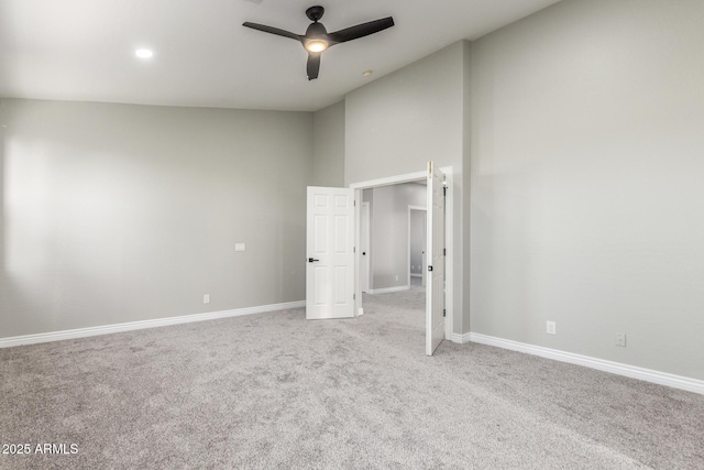 unfurnished bedroom with baseboards, carpet flooring, and a ceiling fan