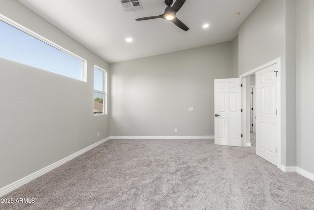 carpeted spare room with baseboards, ceiling fan, recessed lighting, and visible vents