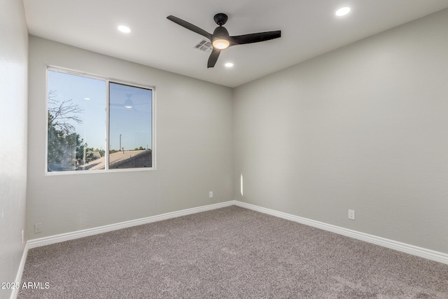 spare room featuring carpet flooring, recessed lighting, ceiling fan, and baseboards