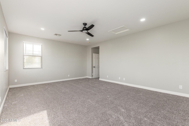 unfurnished room with recessed lighting, attic access, carpet flooring, and visible vents