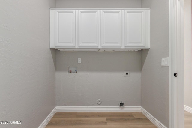 laundry area featuring baseboards, washer hookup, wood finished floors, and hookup for an electric dryer