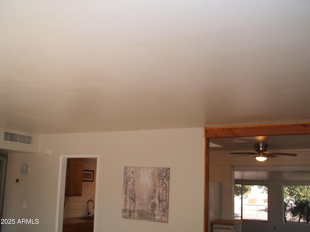 room details featuring sink and ceiling fan