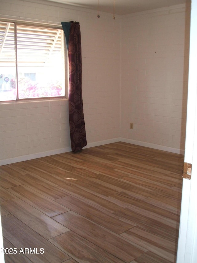 unfurnished room featuring hardwood / wood-style floors