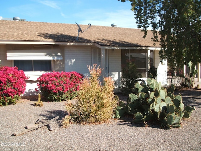 view of home's exterior featuring a shingled roof