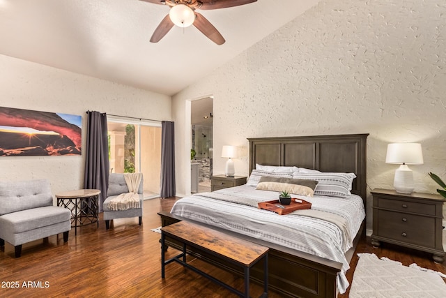 bedroom with a textured wall, ceiling fan, wood finished floors, and vaulted ceiling