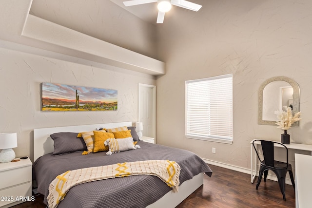 bedroom with baseboards, ceiling fan, and wood finished floors