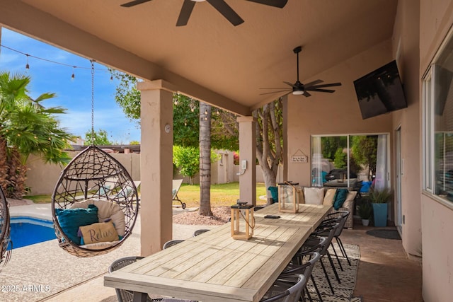 view of patio featuring a ceiling fan, a fenced backyard, and outdoor dining space