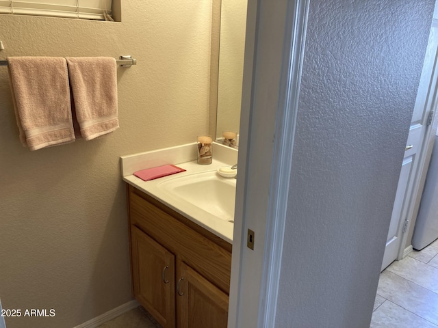 bathroom featuring vanity and tile patterned flooring