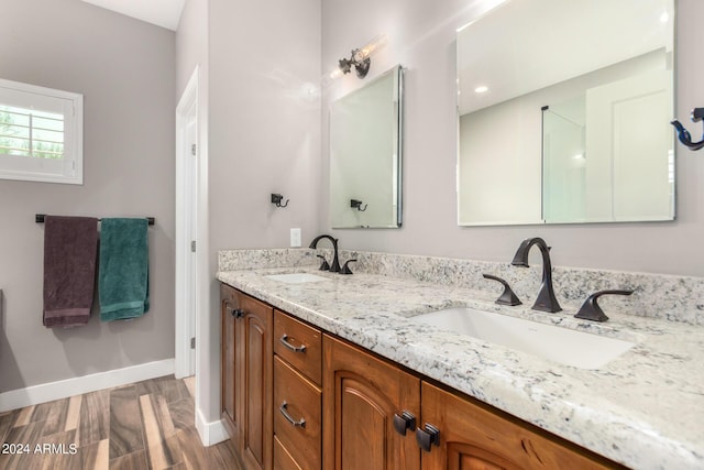 bathroom featuring vanity and wood-type flooring