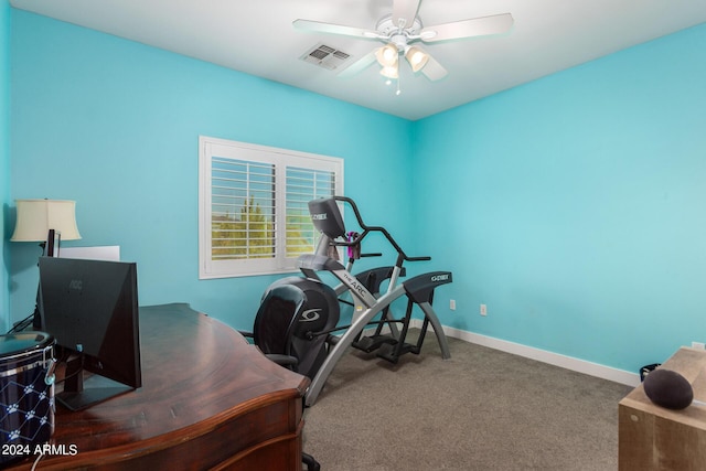 carpeted office featuring ceiling fan