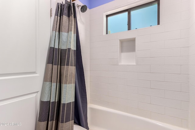 bathroom with shower / tub combo