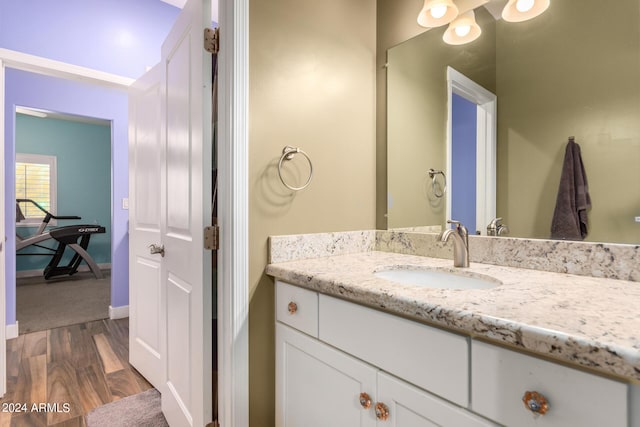 bathroom featuring vanity and hardwood / wood-style flooring