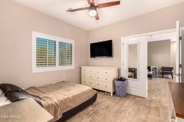 bedroom featuring light hardwood / wood-style floors and ceiling fan