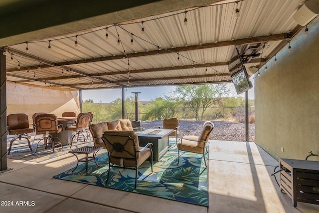 view of patio / terrace with an outdoor living space with a fire pit