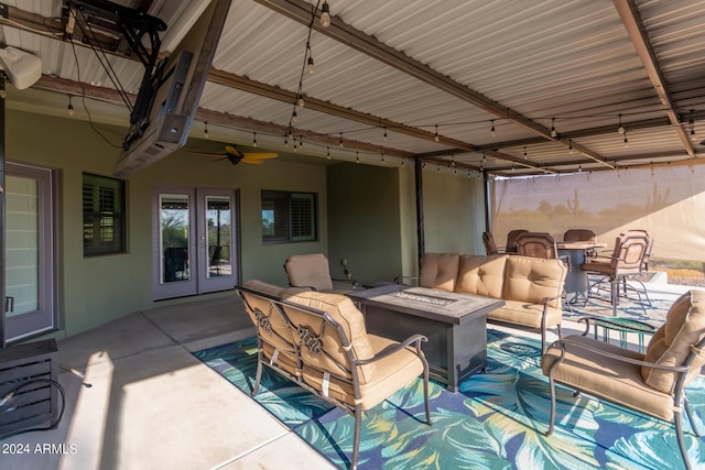 view of patio featuring french doors and an outdoor living space with a fire pit