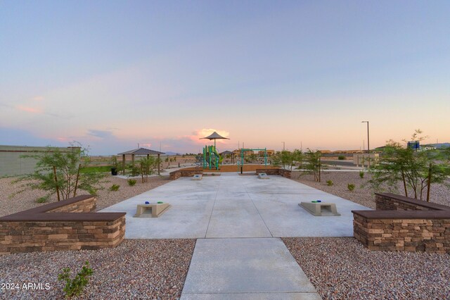 view of patio featuring playground community