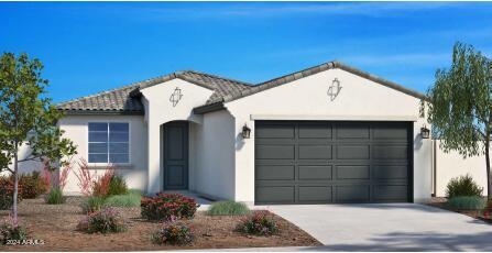 ranch-style home with driveway, a tiled roof, an attached garage, and stucco siding