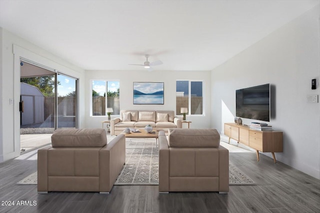 living room with ceiling fan and dark hardwood / wood-style flooring