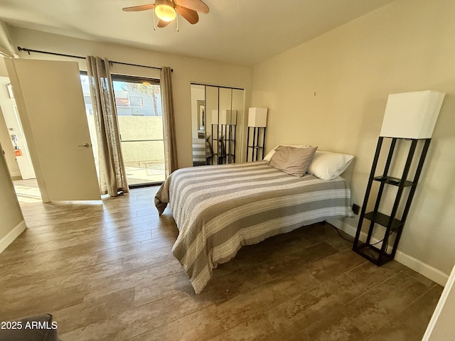 bedroom featuring wood-type flooring and access to exterior