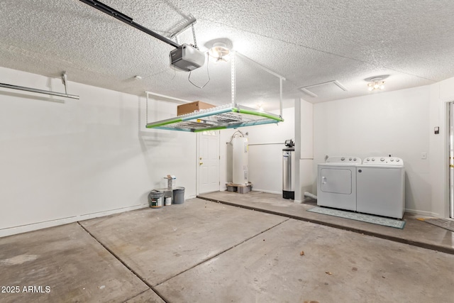 garage with washing machine and dryer and a garage door opener