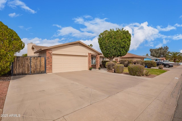 ranch-style home with a garage, driveway, and brick siding