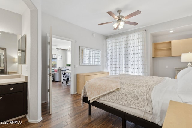 bedroom featuring dark wood-type flooring, a ceiling fan, and baseboards