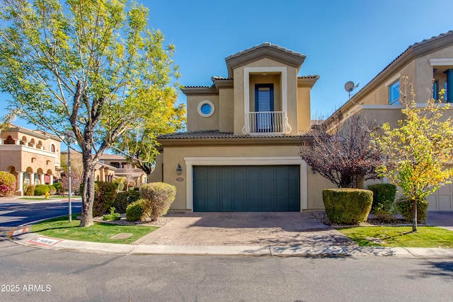 mediterranean / spanish-style home featuring a garage