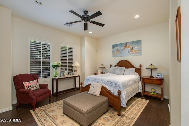 bedroom featuring ceiling fan and dark hardwood / wood-style floors