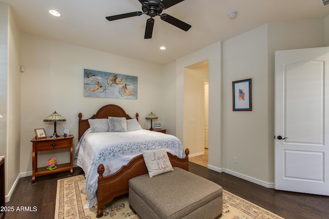 bedroom featuring ceiling fan and dark hardwood / wood-style flooring