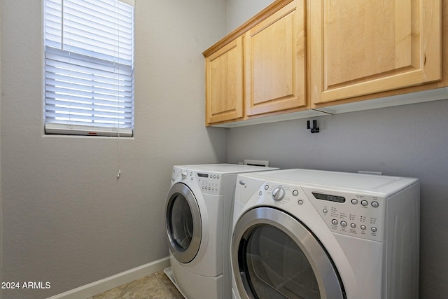 laundry room with cabinets, separate washer and dryer, and a wealth of natural light