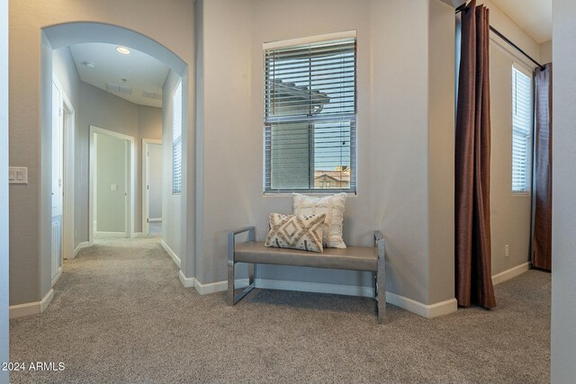 dining space with carpet and an inviting chandelier