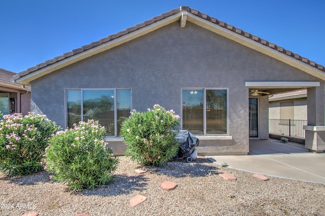 back of property featuring a patio