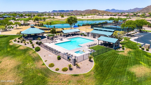 view of swimming pool with a water and mountain view, a lawn, a patio, and a gazebo