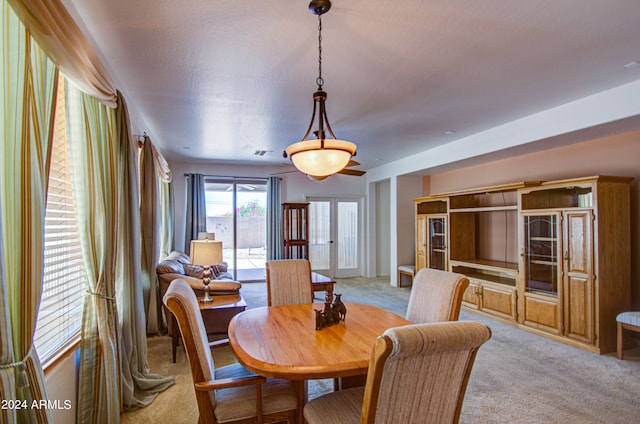 dining space featuring carpet flooring