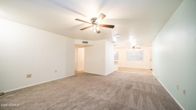 unfurnished living room with ceiling fan and light carpet