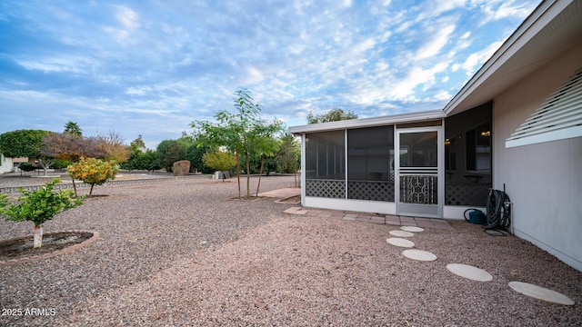 view of yard with a sunroom