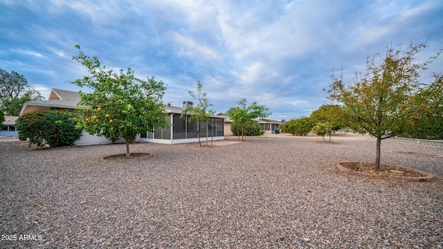 view of yard featuring a sunroom