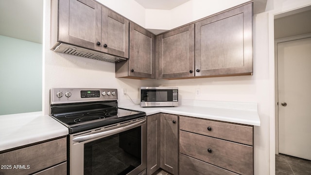 kitchen featuring dark brown cabinets and appliances with stainless steel finishes