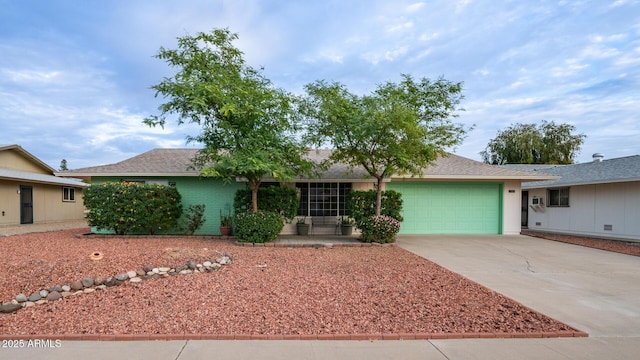 single story home featuring a garage