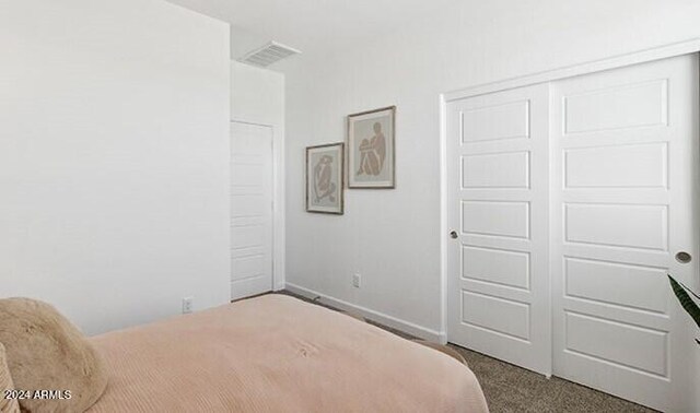 1336 W Hess Ave, Coolidge, AZ 85128 - bedroom with carpet, a closet, and baseboards