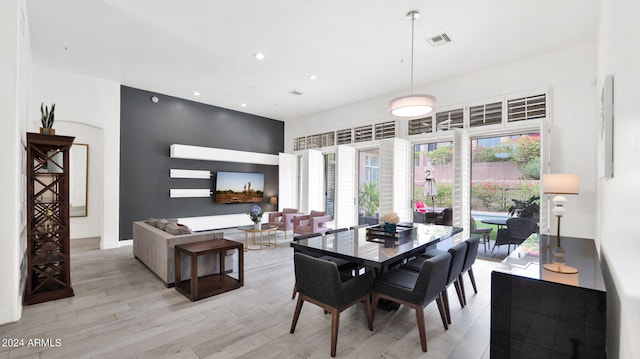 dining area featuring recessed lighting, visible vents, and light wood finished floors