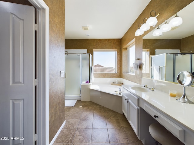 bathroom featuring a stall shower, visible vents, tile patterned floors, a garden tub, and vanity