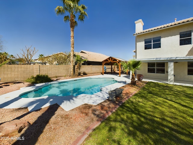 view of swimming pool featuring a fenced in pool, a fenced backyard, a lawn, and a gazebo