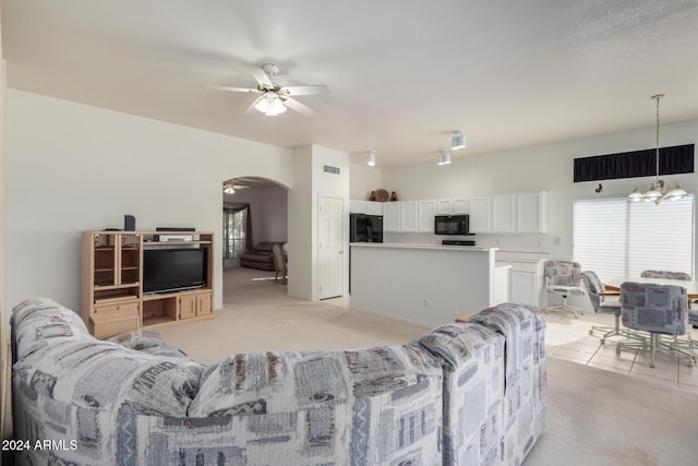 11553 W Sonoran Ct, Surprise, AZ 85378 - carpeted living room with ceiling fan with notable chandelier