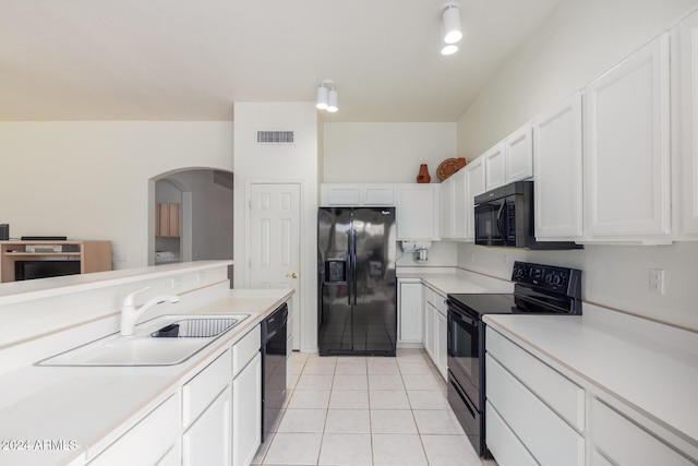 11553 W Sonoran Ct, Surprise, AZ 85378 - kitchen with black appliances, white cabinets, light tile patterned floors, and sink