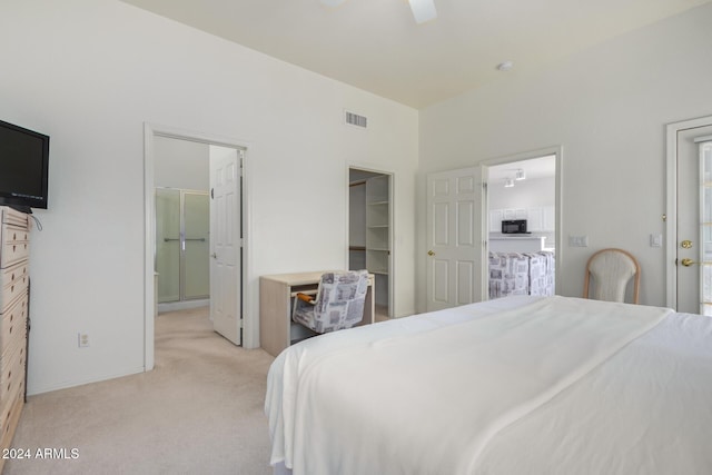 11553 W Sonoran Ct, Surprise, AZ 85378 - carpeted bedroom with a walk in closet, a closet, ceiling fan, and connected bathroom