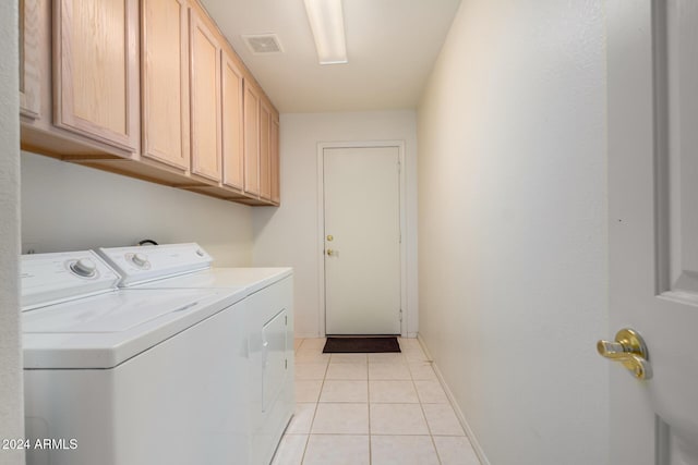 11553 W Sonoran Ct, Surprise, AZ 85378 - clothes washing area with cabinets, light tile patterned floors, and washer and dryer