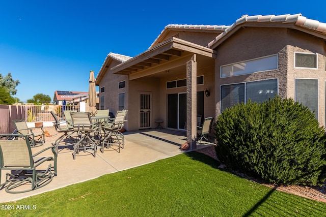 11553 W Sonoran Ct, Surprise, AZ 85378 - rear view of property with a lawn and a patio area