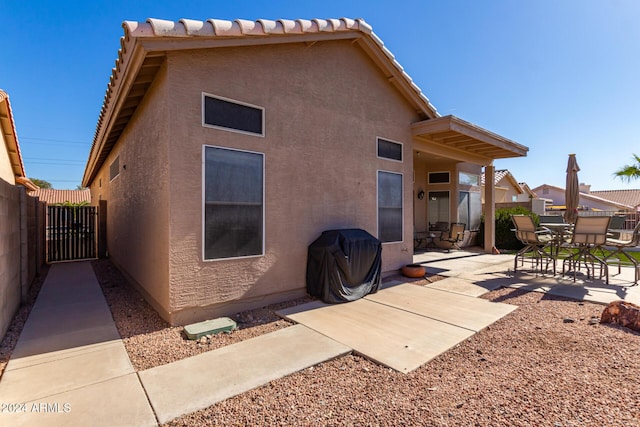 11553 W Sonoran Ct, Surprise, AZ 85378 - rear view of property featuring a patio