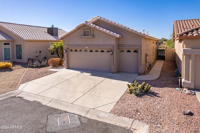 11553 W Sonoran Ct, Surprise, AZ 85378 - view of front facade featuring a garage
